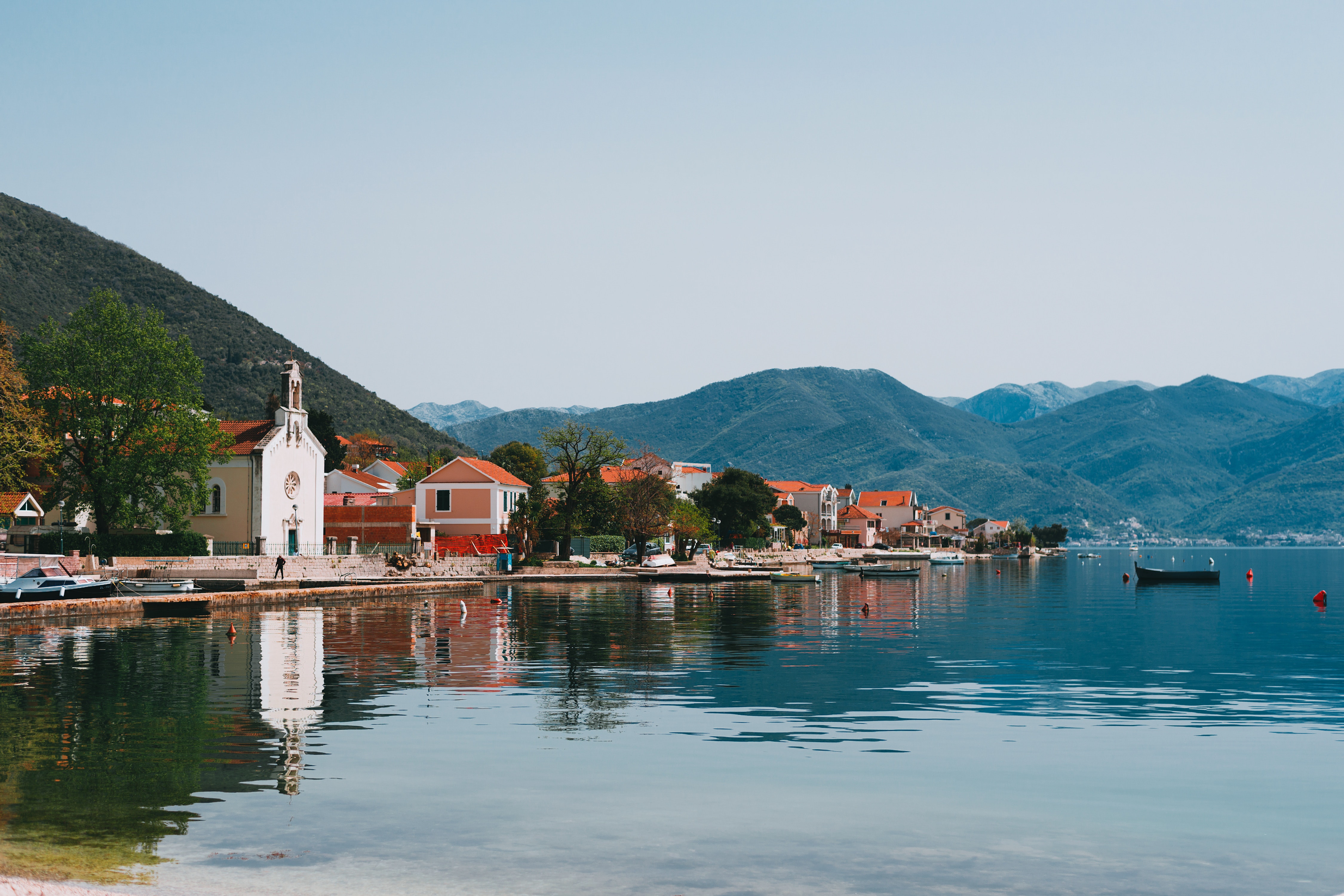 town buildings on the side of a lake